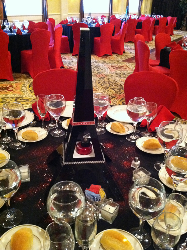  spilling over with Eiffel Tower centerpieces and red and black decor